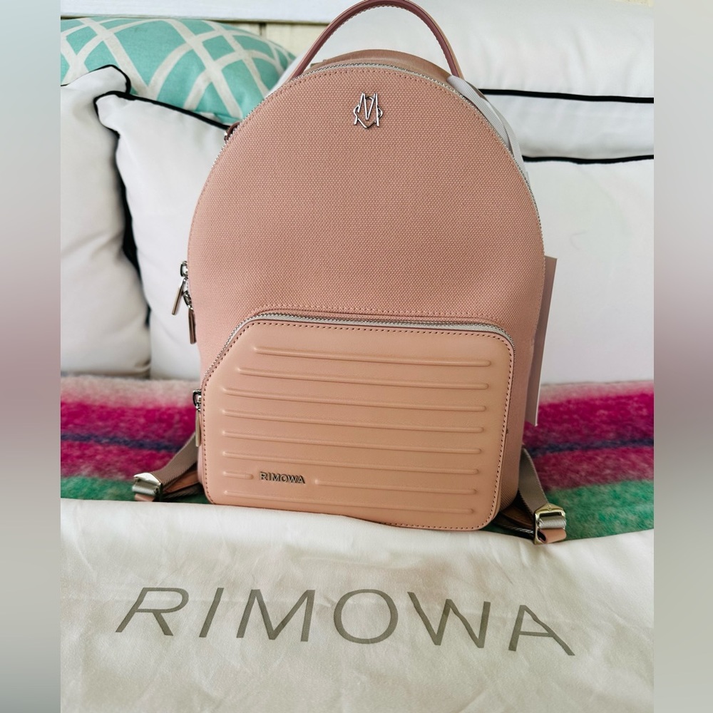 Selling an authentic Rimowa Backpack Daypack Never Still sz S color Desert Rose